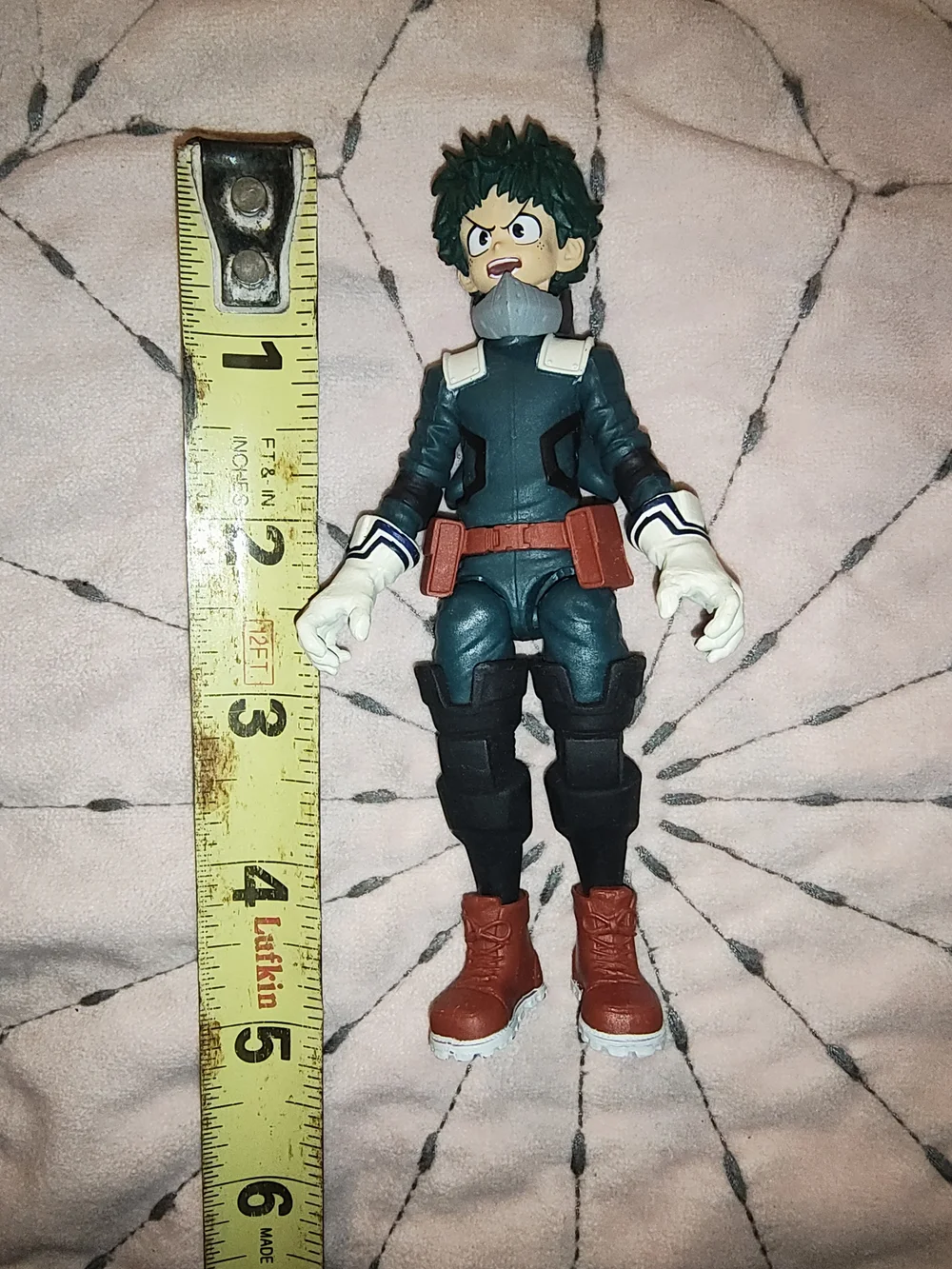 Green and Red Superhero Action Figure with White Gloves